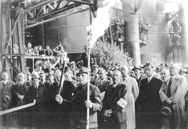 Celebration at the Thyssen-Hütte on May 7, 1951 as the first blast furnace is restarted after the war. In the foreground the oldest blast furnace man in the workforce at the time.